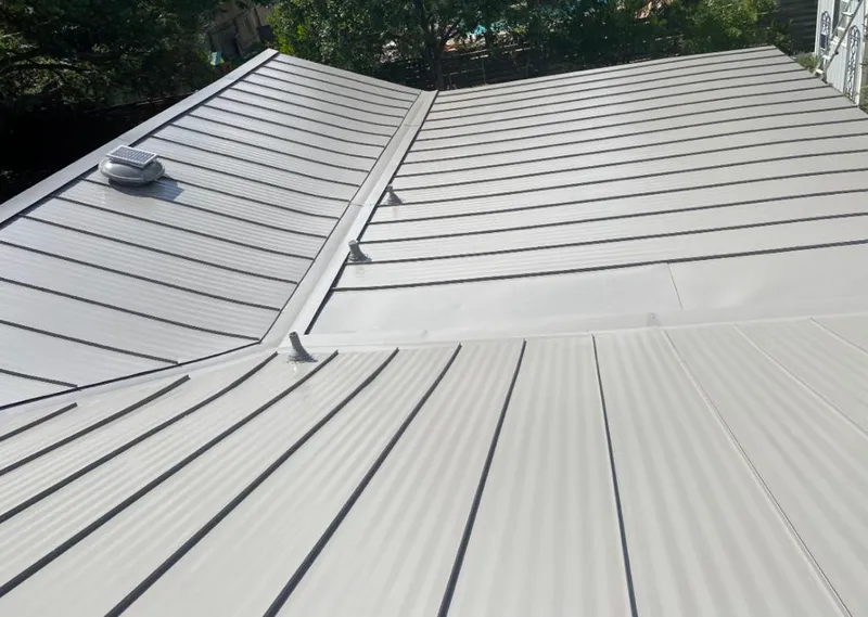 Solar attic fan installed on a metal roof for Roof Ventilation in Whitemarsh Island
